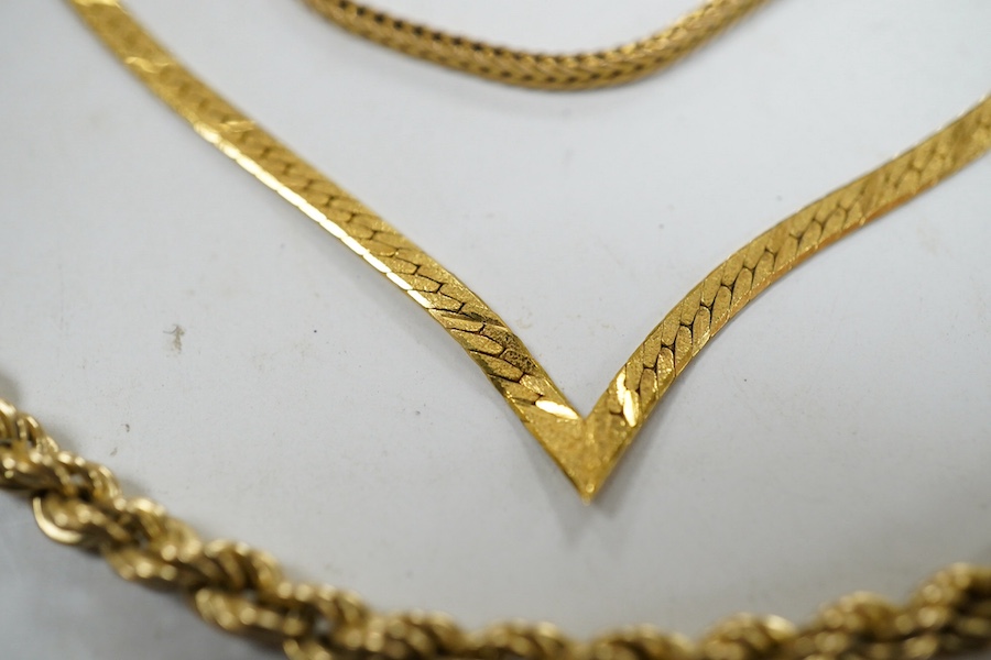 Four assorted 9ct gold chains or necklaces and a 9ct gold bar brooch, 14.7 grams. Condition - fair to good